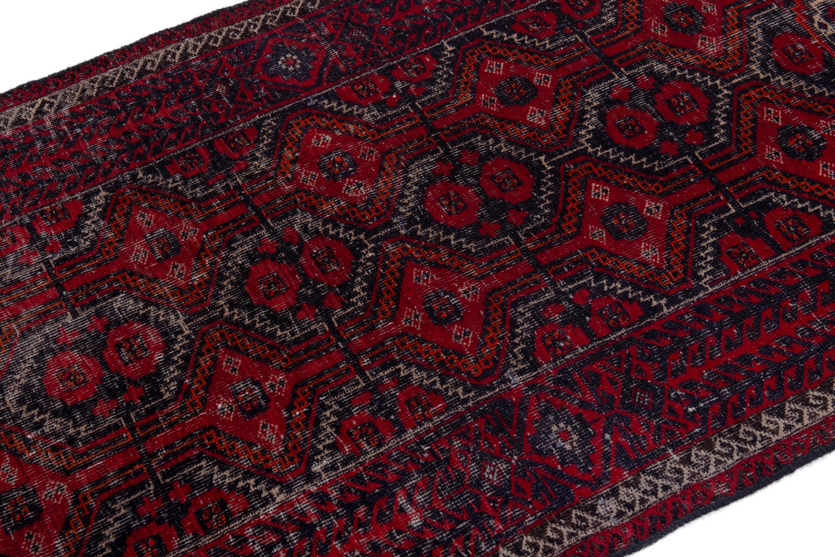 Persian Baluch accent rug in burgundy and faded red, view 6 of 17