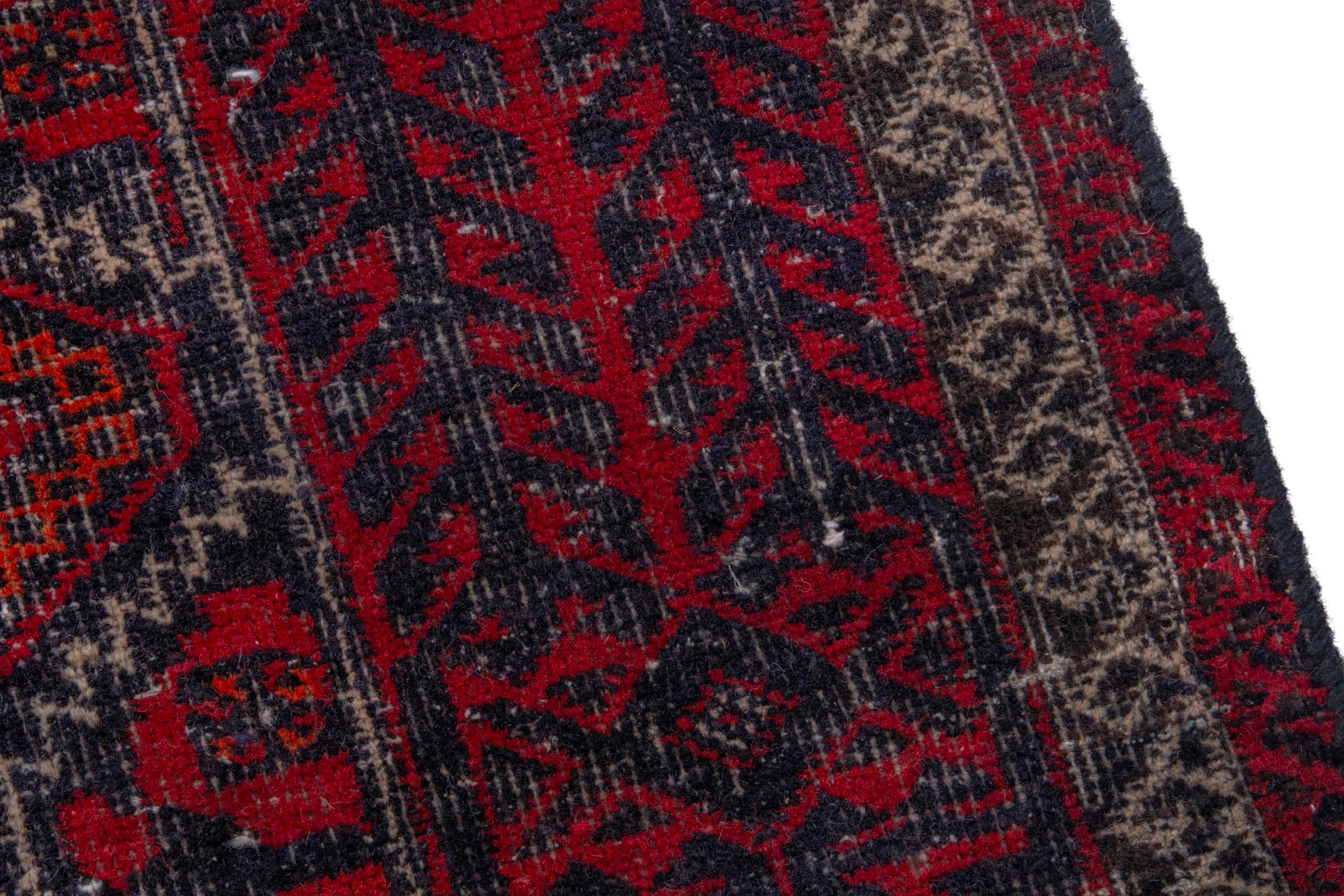 Persian Baluch accent rug in burgundy and faded red, view 7 of 17