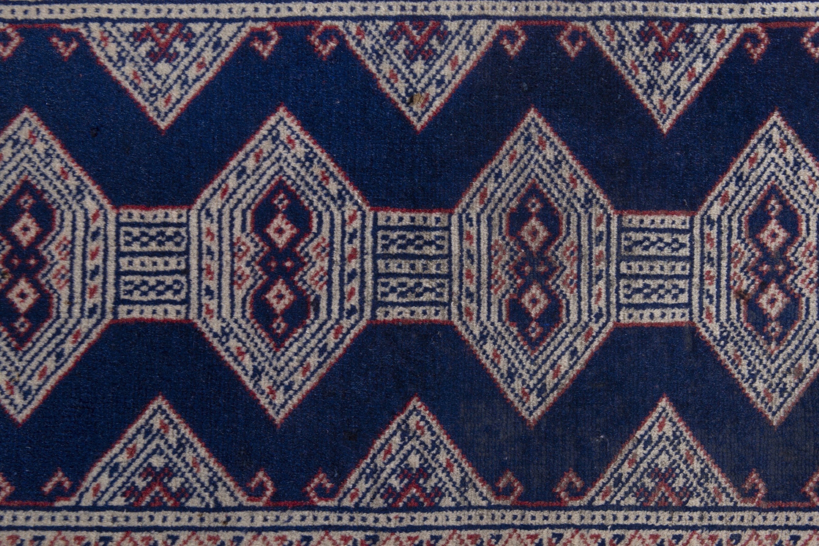 Persian Torkaman accent rug in navy and greige, view 8 of 9