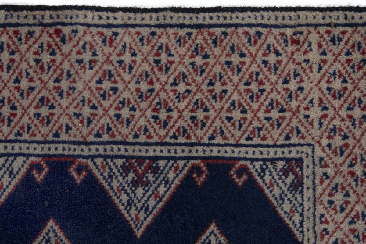 Persian Torkaman accent rug in navy and greige, view 8 of 10