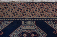 Persian Torkaman accent rug in navy and greige, view 9 of 10