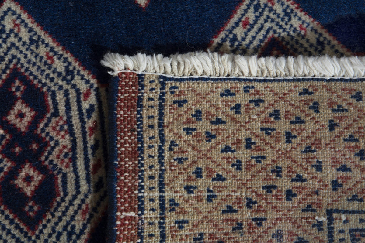 Persian Torkaman accent rug in navy and greige, view 9 of 9