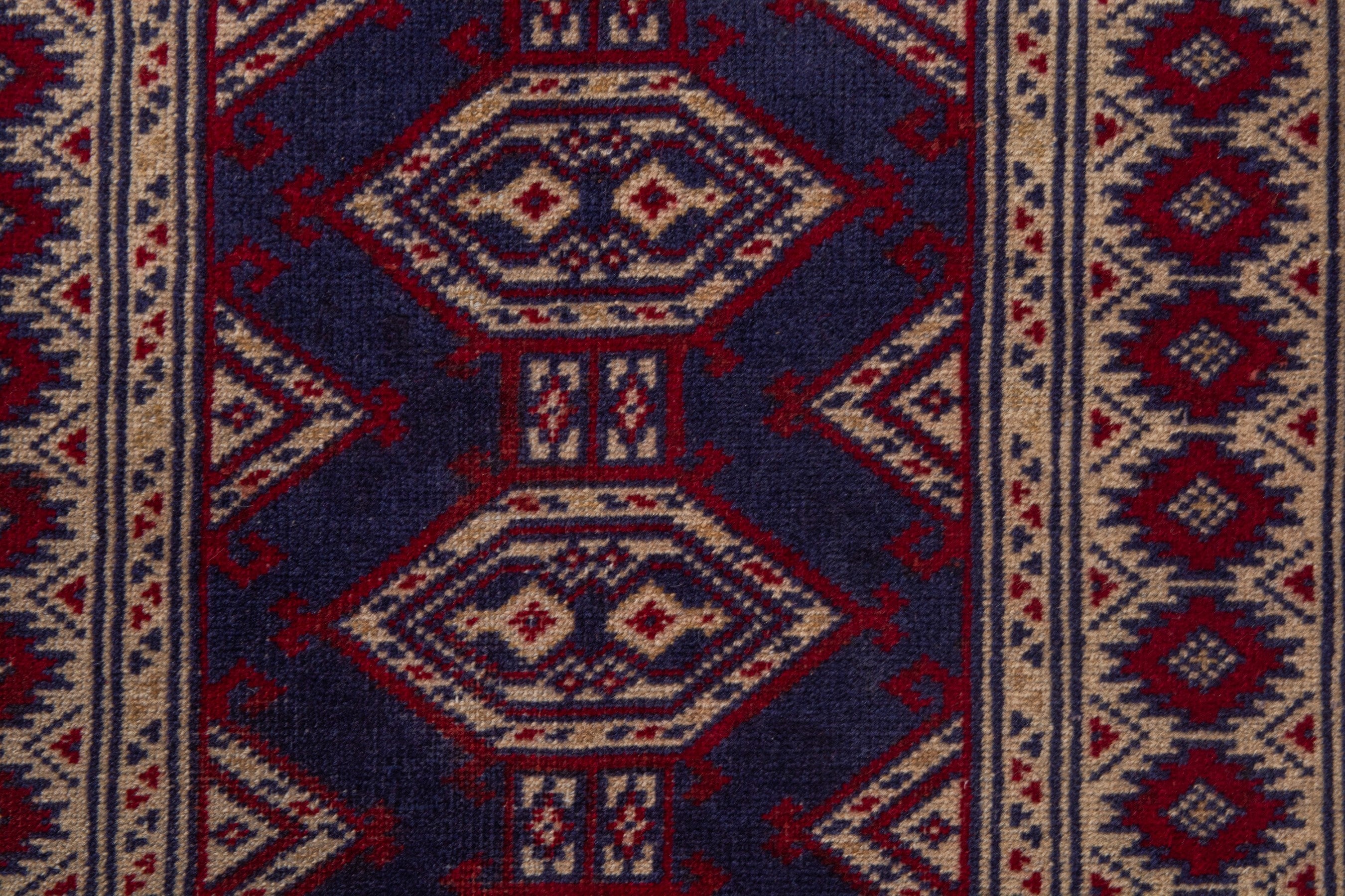 Persian Torkaman accent rug in navy and cream, view 7 of 8