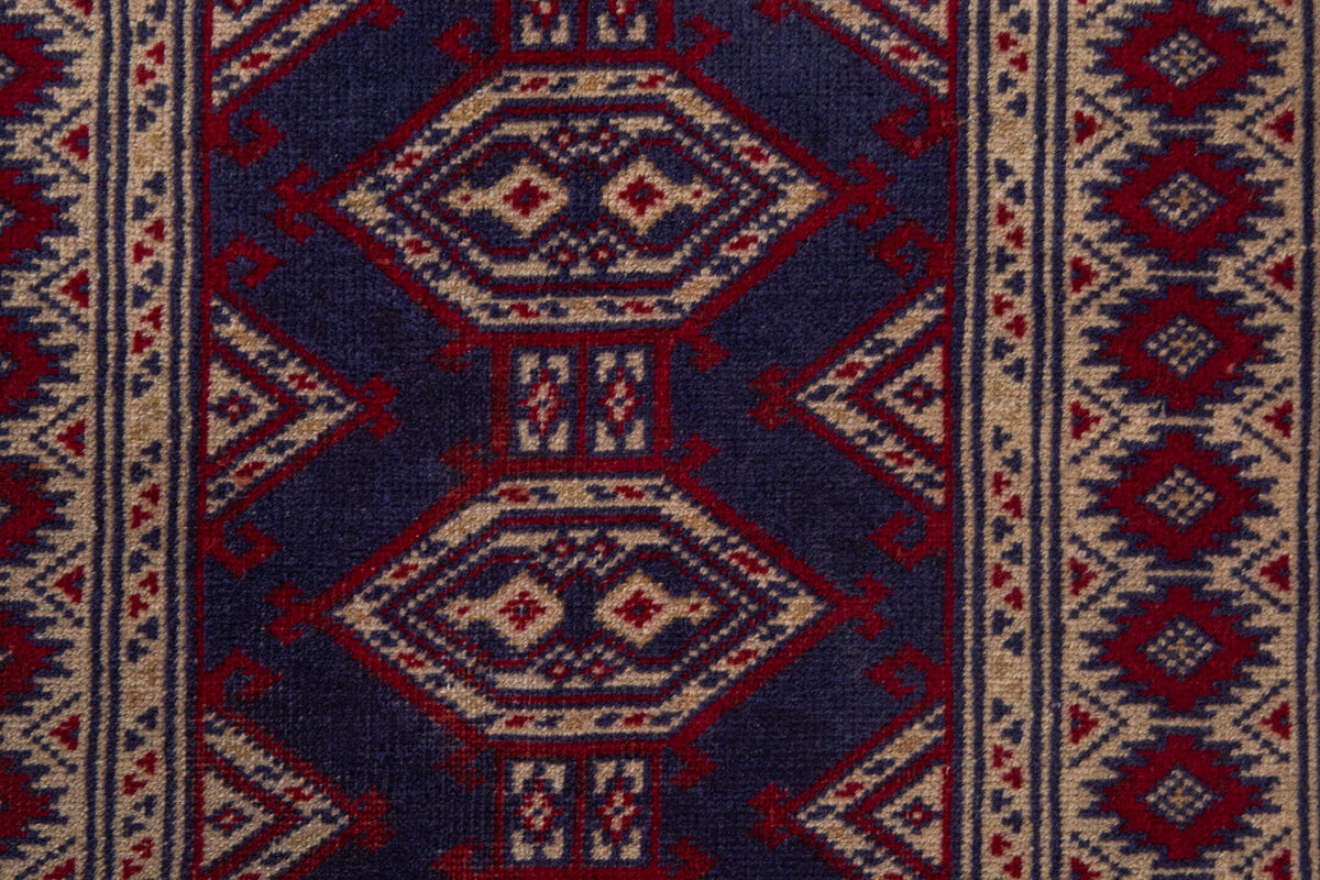 Persian Torkaman accent rug in navy and cream, view 8 of 9