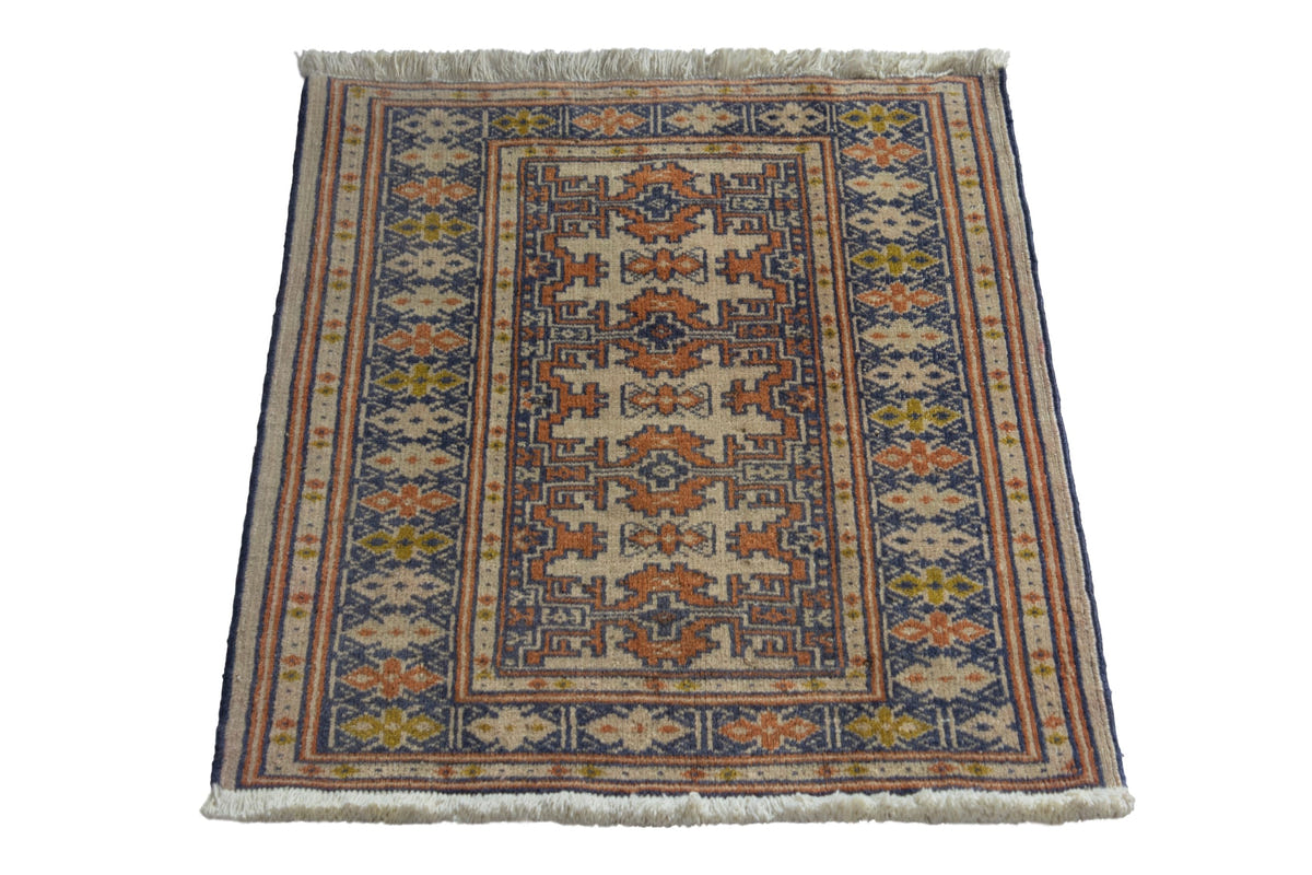 Persian Torkaman accent rug in cream and navy, view 3 of 9