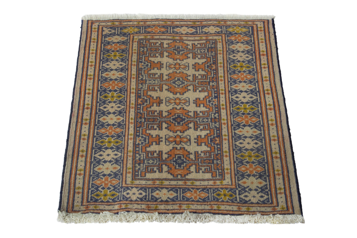 Persian Torkaman accent rug in cream and navy, view 4 of 9