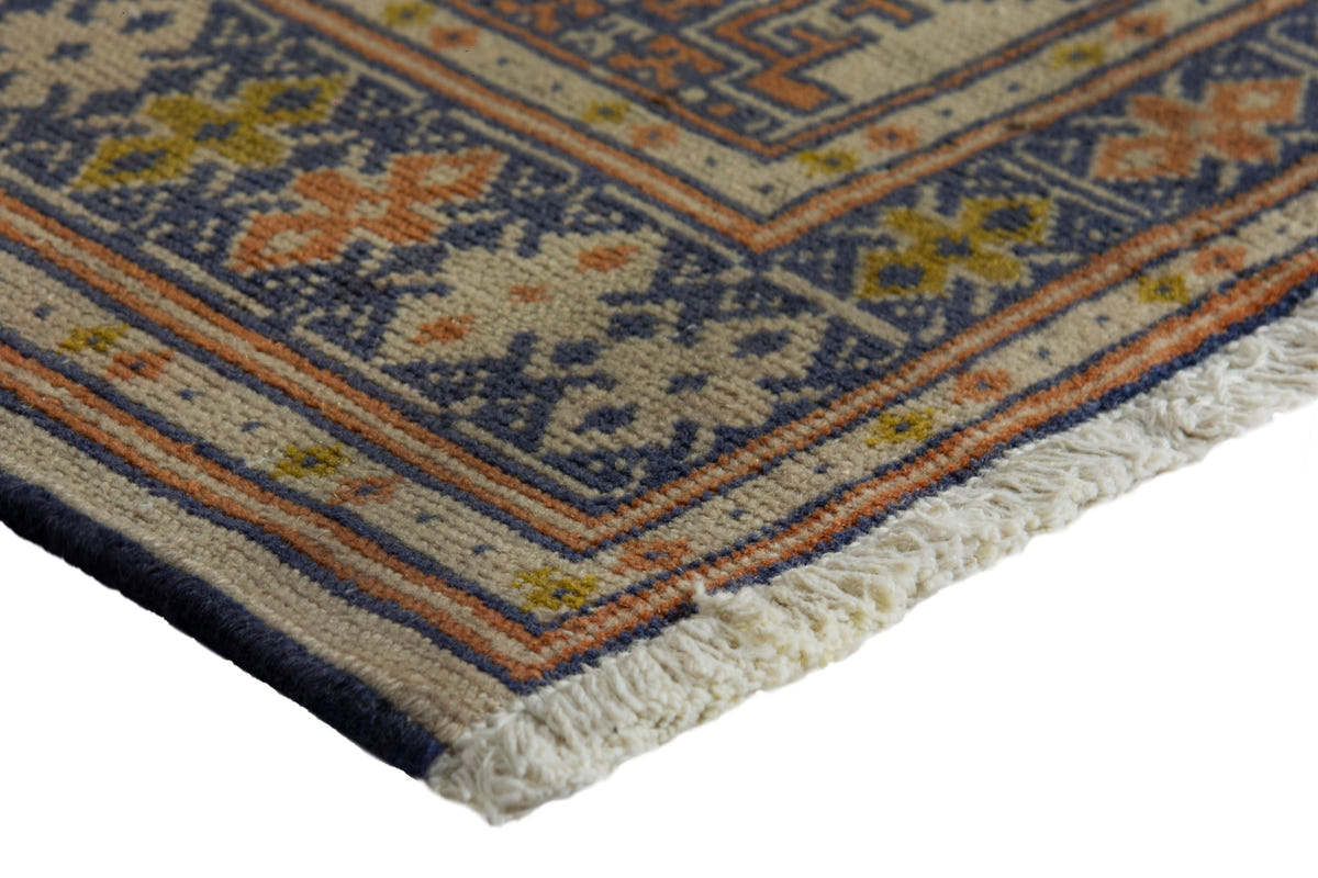 Persian Torkaman accent rug in cream and navy, view 6 of 9