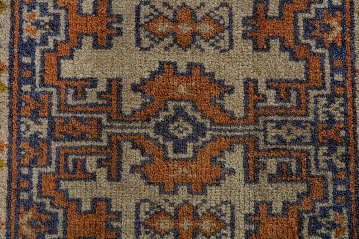 Persian Torkaman accent rug in cream and navy, view 7 of 9