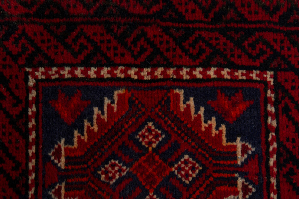 Persian Baluch accent rug in deep red and black, view 8 of 9