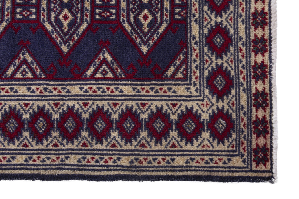 Persian Torkaman accent rug in navy and cream, view 5 of 9