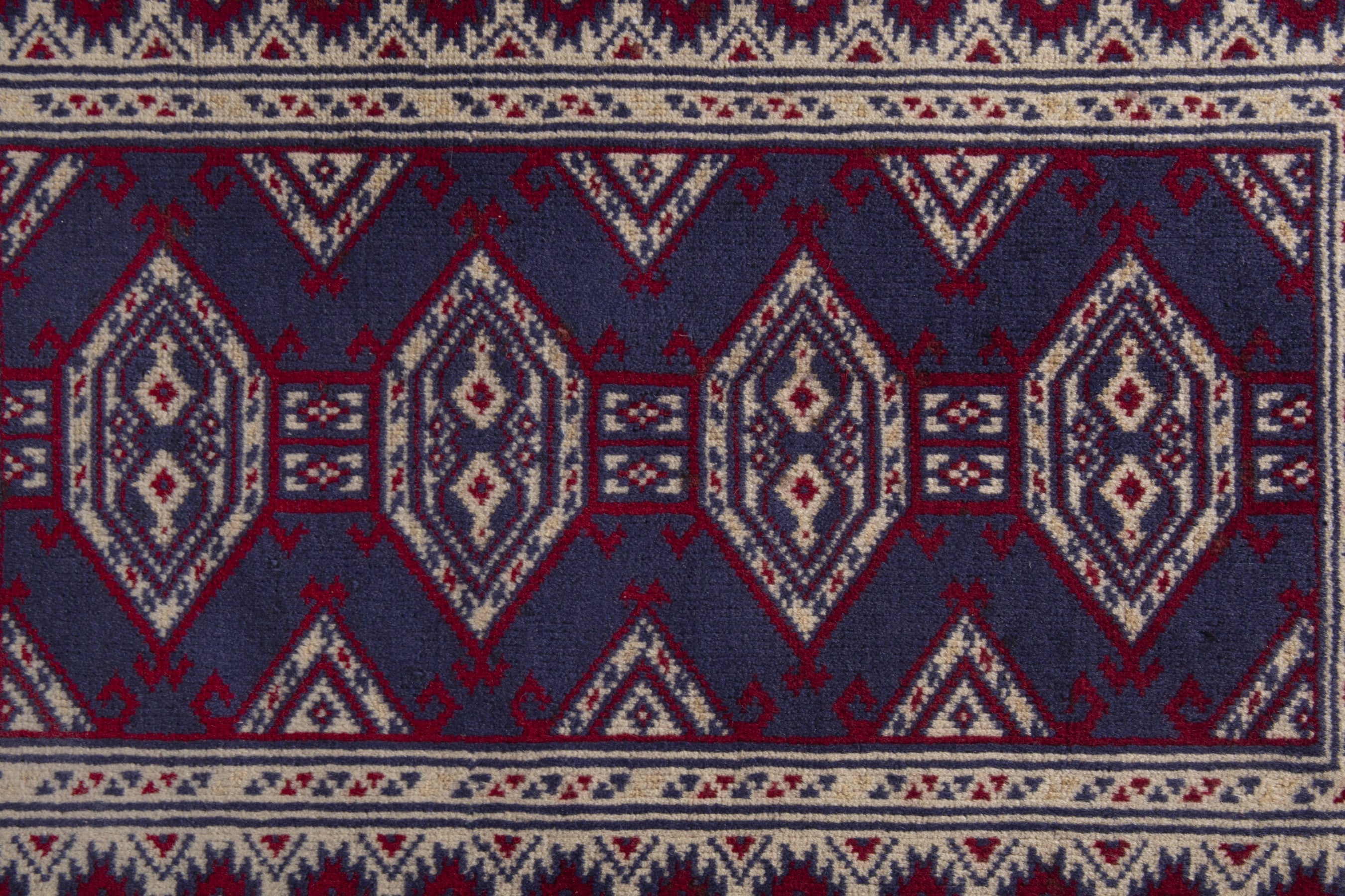Persian Torkaman accent rug in navy and cream, view 7 of 8