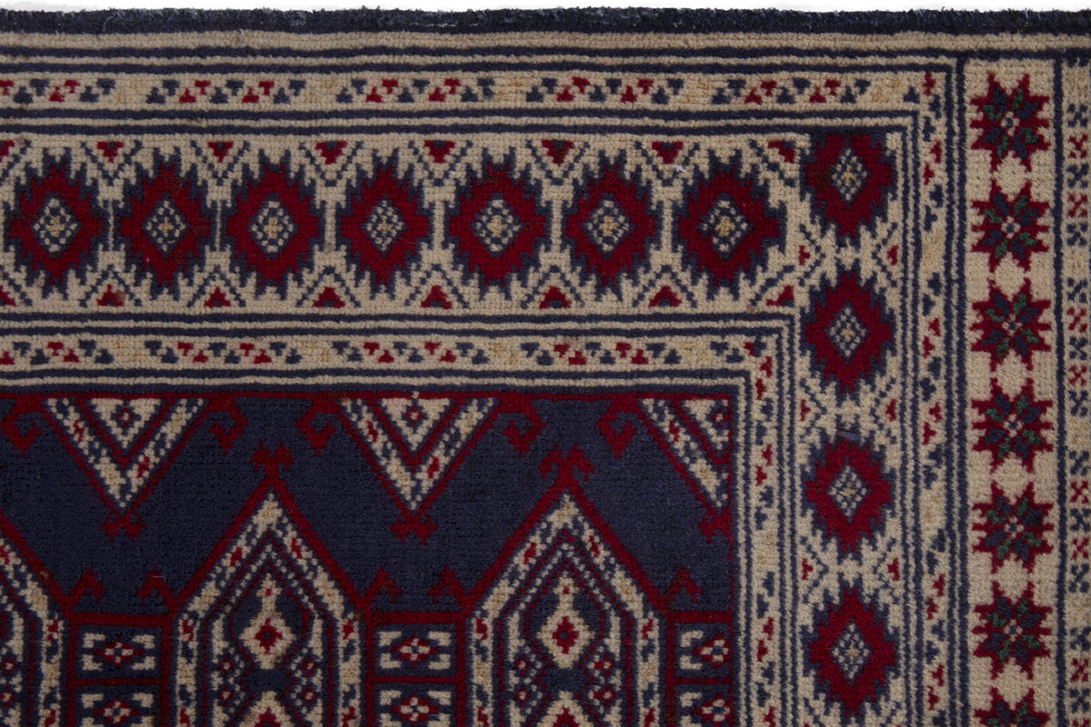 Persian Torkaman accent rug in navy and cream, view 8 of 9