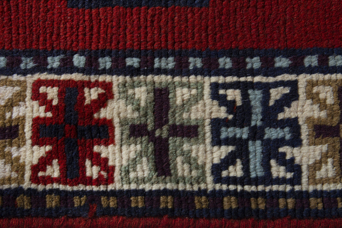 Persian Ghoochan accent rug in deep red and cream, view 9 of 10