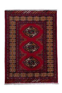 Persian Torkaman accent rug in deep red and ochre, view 2 of 9