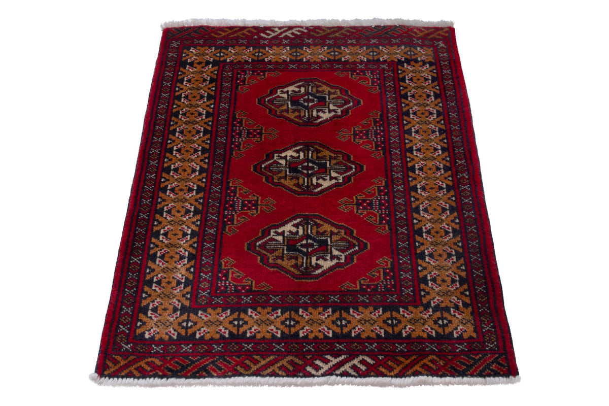 Persian Torkaman accent rug in deep red and ochre, view 3 of 9