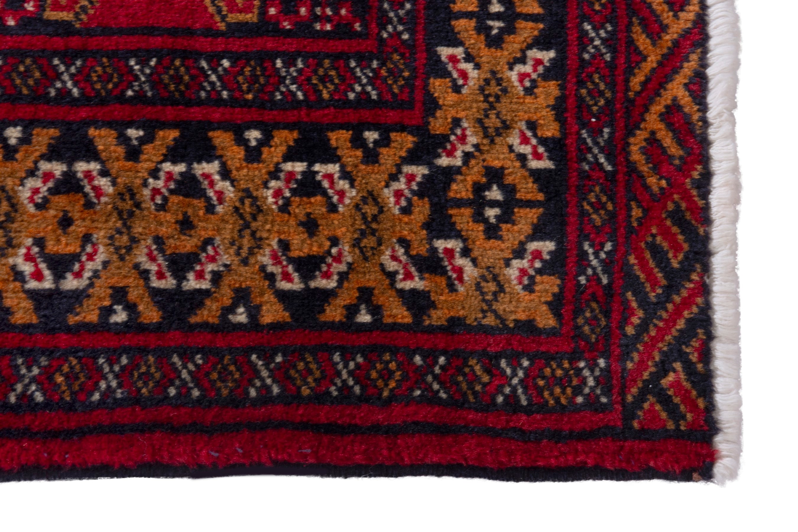 Persian Torkaman accent rug in deep red and ochre, view 5 of 8