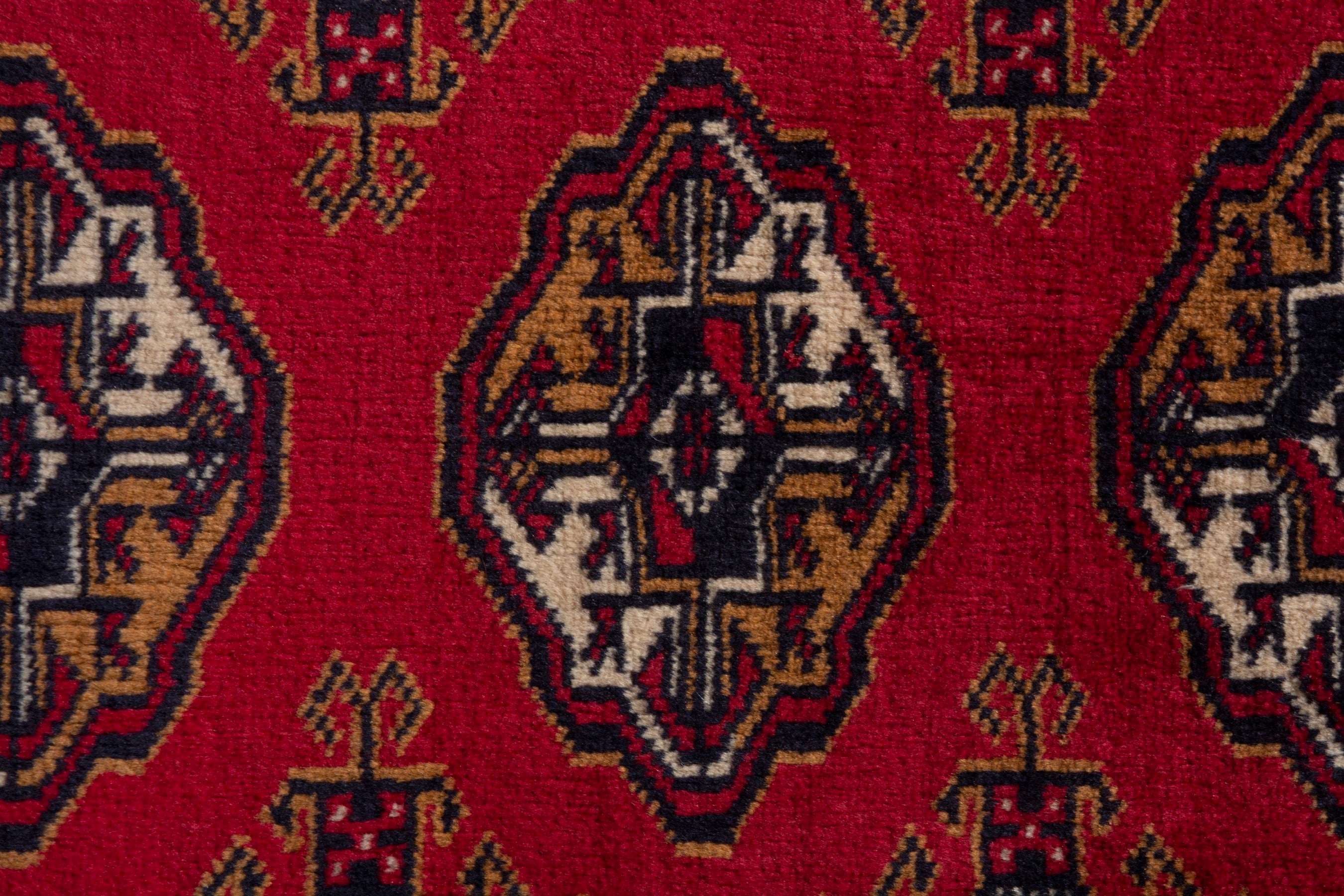 Persian Torkaman accent rug in deep red and ochre, view 6 of 8