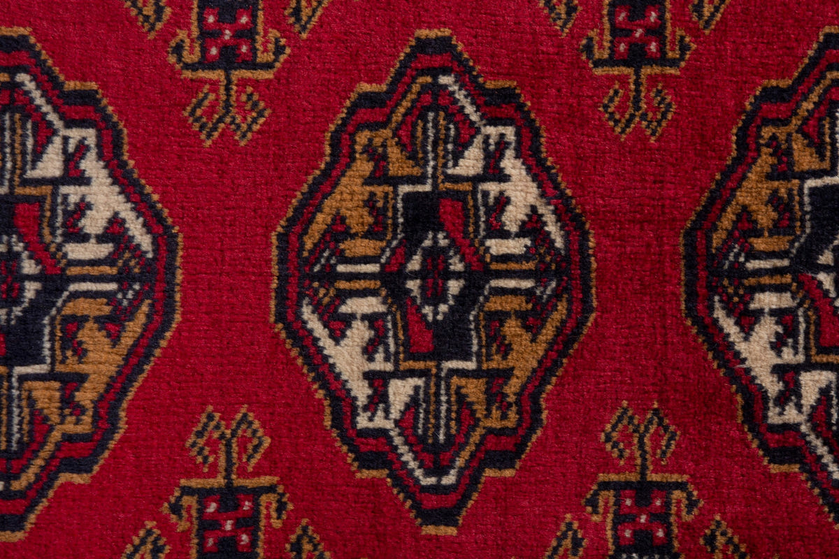 Persian Torkaman accent rug in deep red and ochre, view 7 of 9