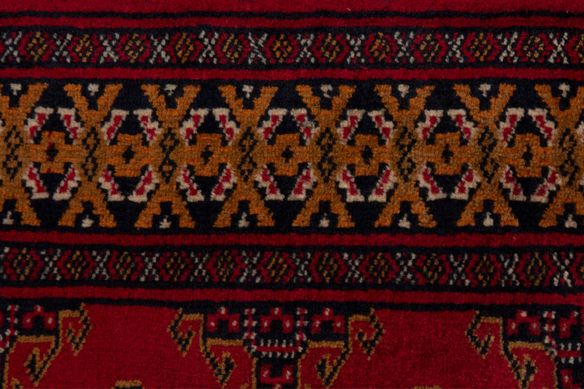 Persian Torkaman accent rug in deep red and ochre, view 8 of 9