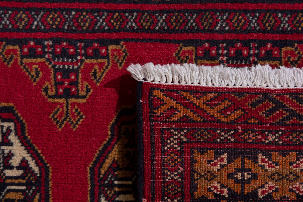 Persian Torkaman accent rug in deep red and ochre, view 9 of 9