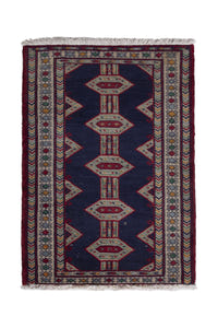 Persian Baluch accent rug in navy and cream, view 2 of 9