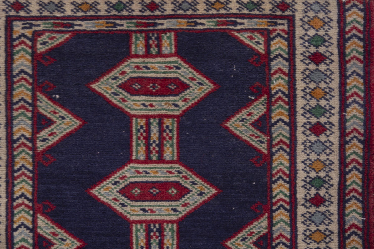 Persian Baluch accent rug in navy and cream, view 8 of 9