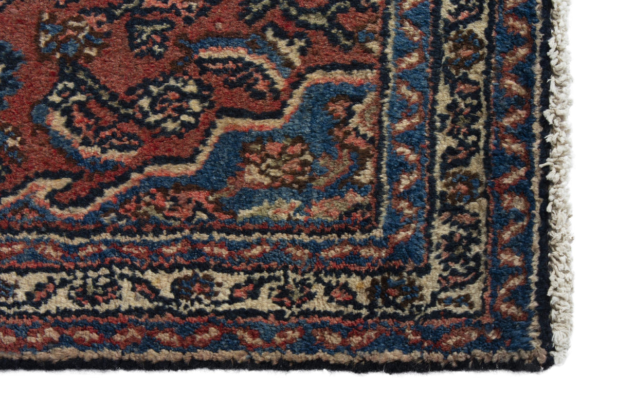 Persian Hamadan accent rug in brick and navy, view 5 of 10