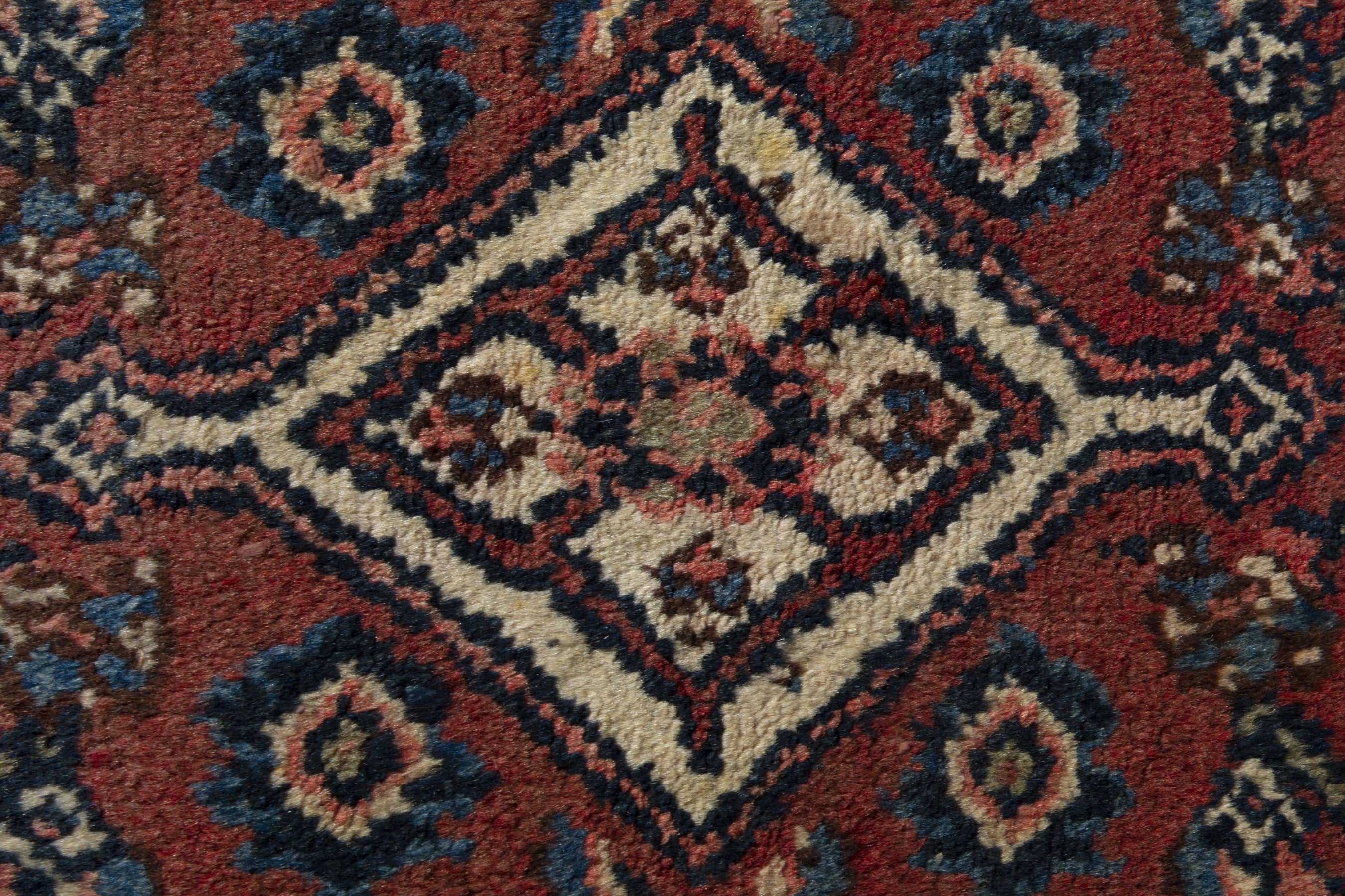 Persian Hamedan accent rug in brick and navy, view 8 of 9