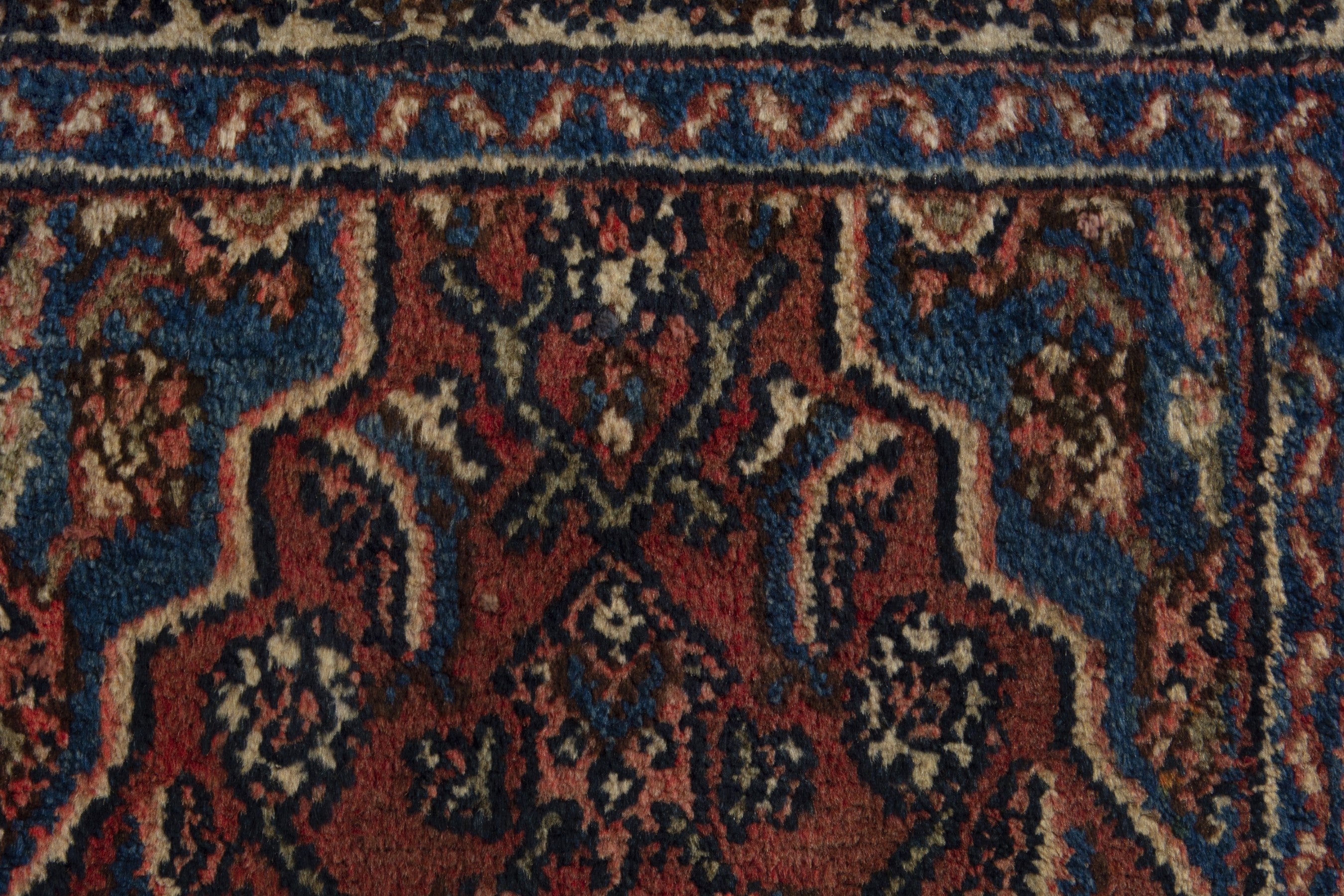 Persian Hamedan accent rug in brick and navy, view 7 of 9
