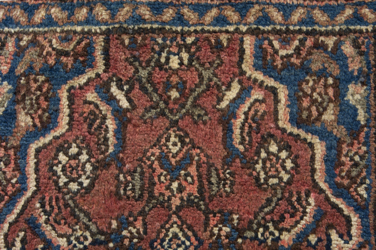 Persian Hamadan accent rug in brick and navy, view 8 of 10