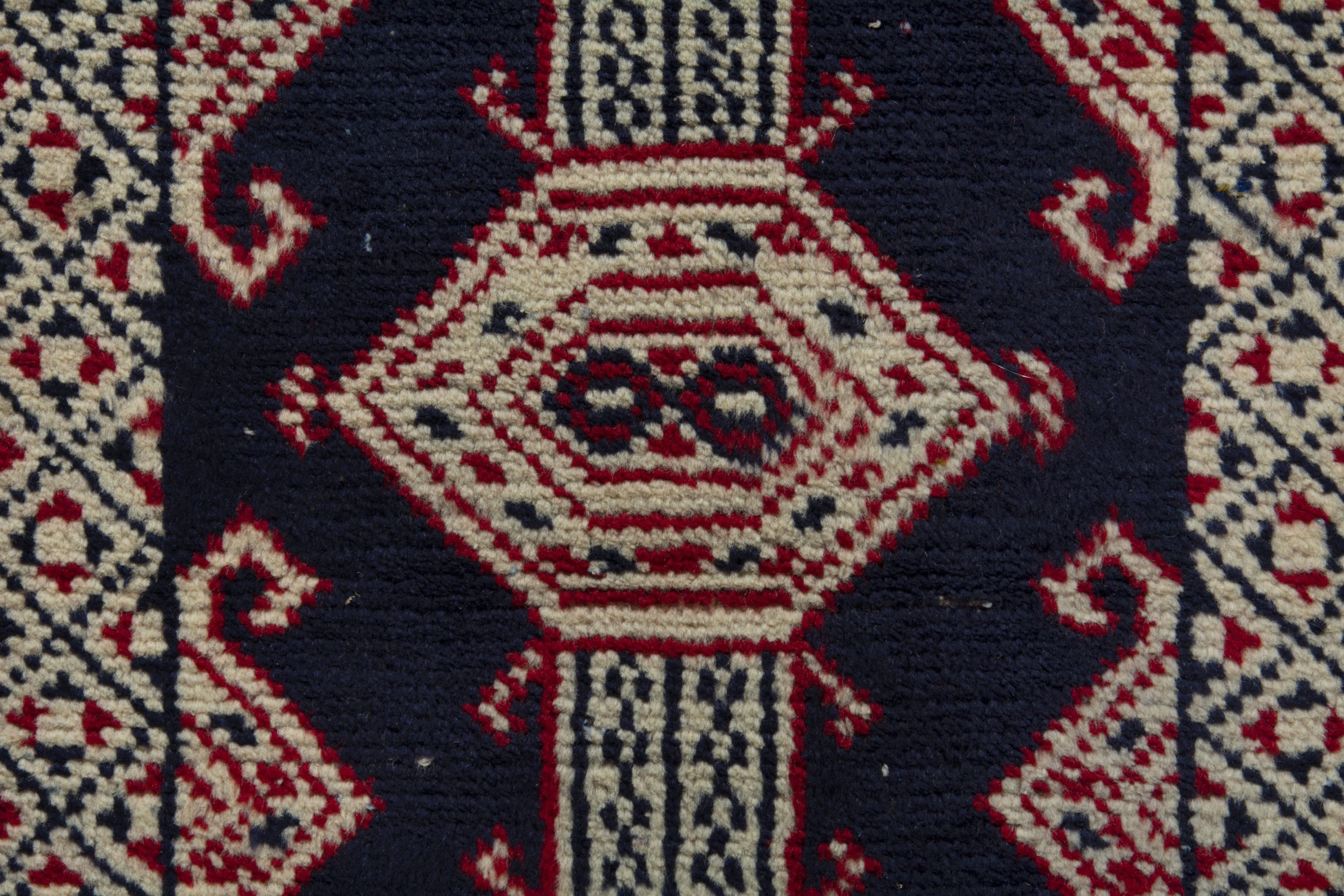 Persian Torkaman accent rug in navy and cream, view 6 of 8