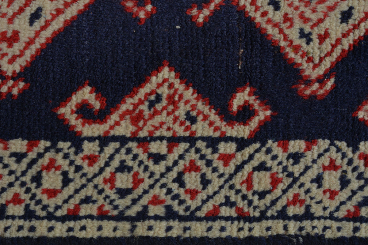 Persian Torkaman accent rug in navy and cream, view 8 of 9