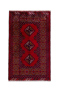 Persian Torkaman accent rug in deep red and navy, view 2 of 9