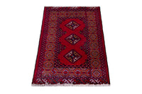 Persian Torkaman accent rug in deep red and navy, view 3 of 9