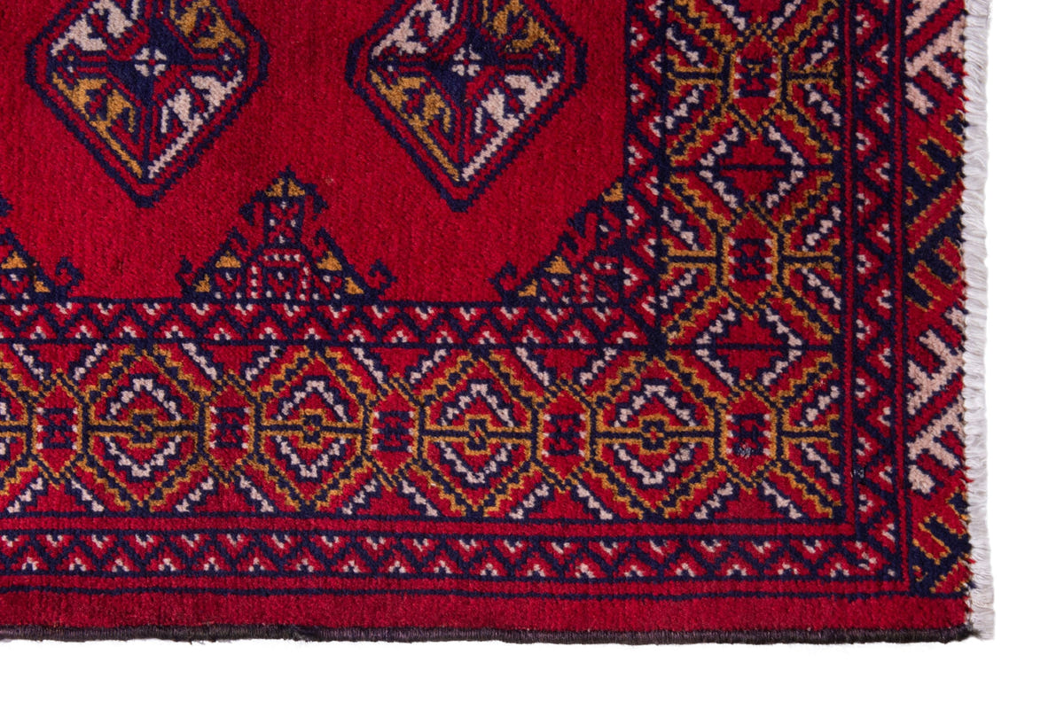 Persian Torkaman accent rug in deep red and navy, view 5 of 9