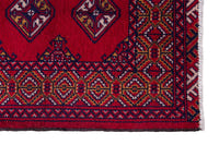Persian Torkaman accent rug in deep red and navy, view 5 of 9