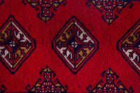 Persian Torkaman accent rug in deep red and navy, view 7 of 9