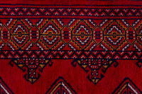 Persian Torkaman accent rug in deep red and navy, view 8 of 9