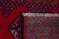 Persian Torkaman accent rug in deep red and navy, view 9 of 9