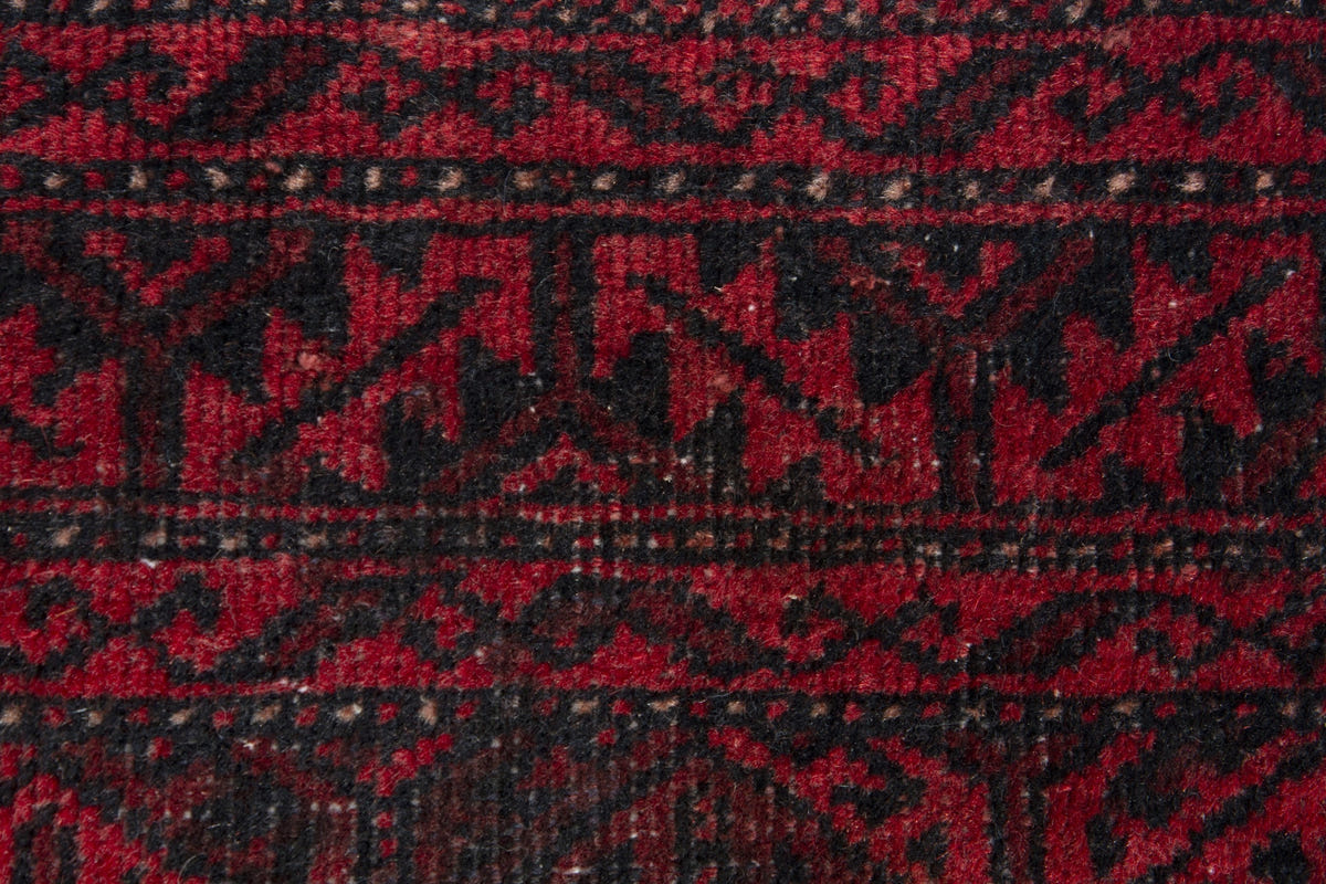 Persian Baluch accent rug in deep red and black, view 8 of 9