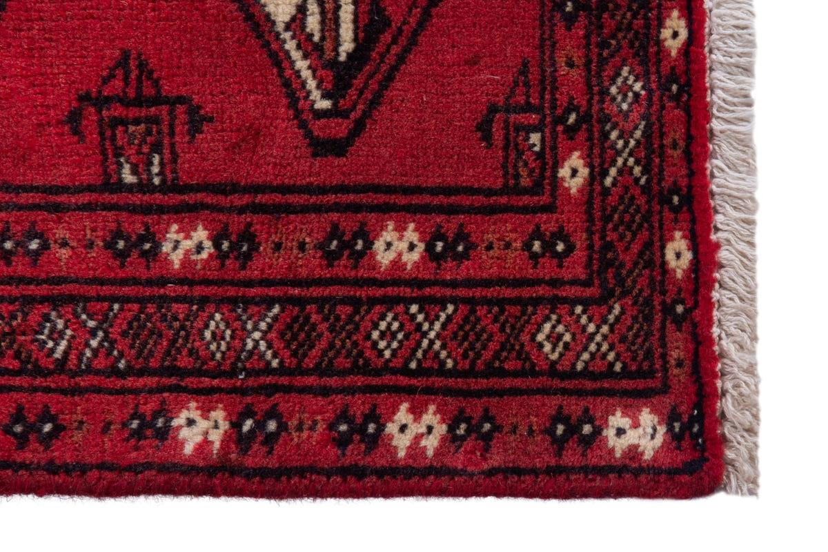 Persian Torkaman accent rug in deep red and black, view 5 of 9