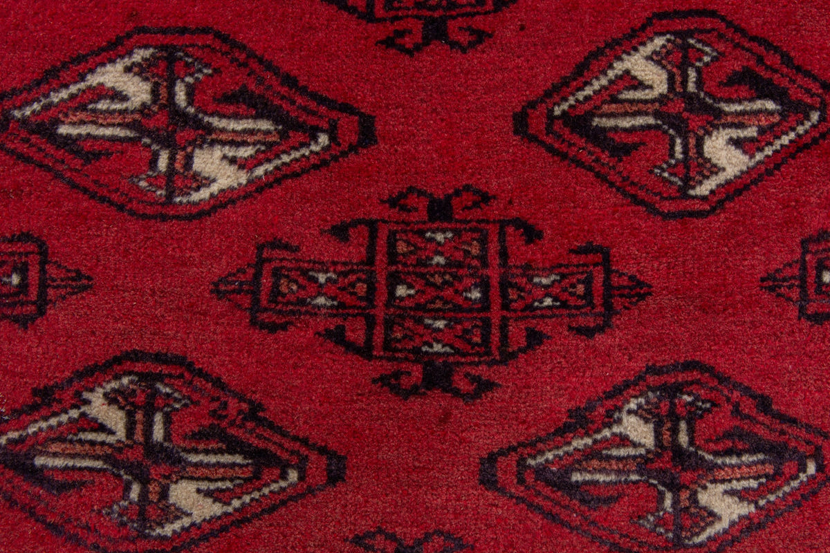 Persian Torkaman accent rug in deep red and black, view 7 of 9