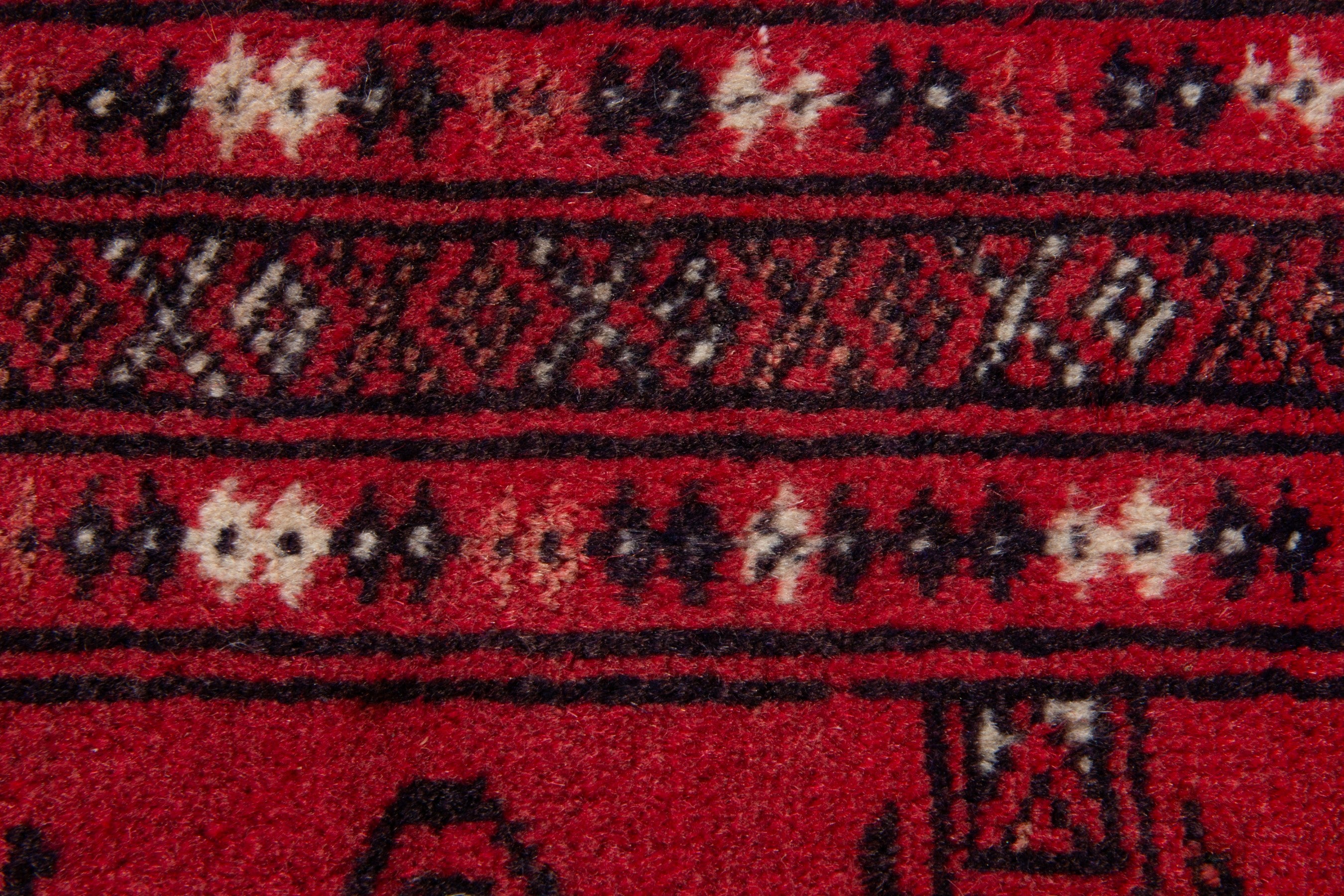 Persian Torkaman accent rug in deep red and black, view 7 of 8