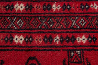 Persian Torkaman accent rug in deep red and black, view 8 of 9
