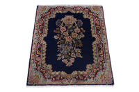 Persian Kerman accent rug in navy and burgundy, view 3 of 8