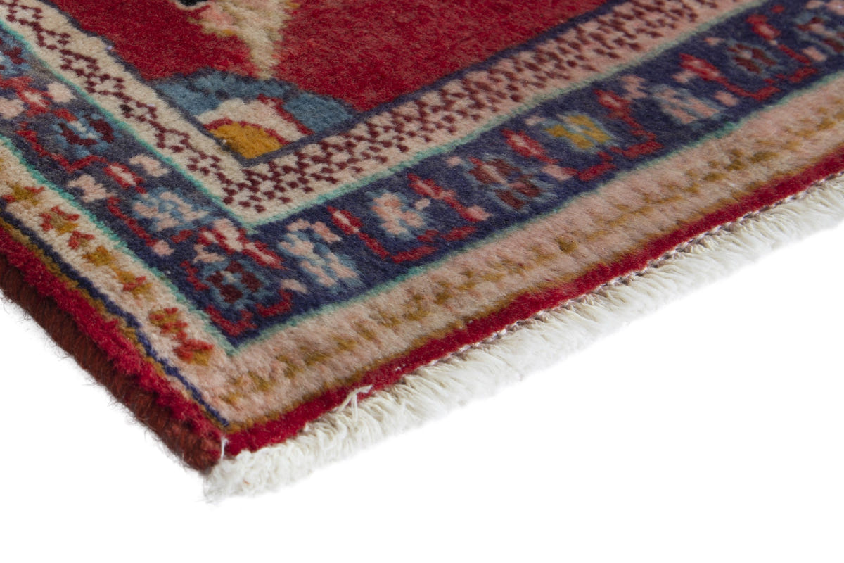 Persian Arak accent rug in deep red and navy, view 6 of 9