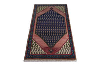 Persian Songhor accent rug in navy and dusty rose, view 4 of 9
