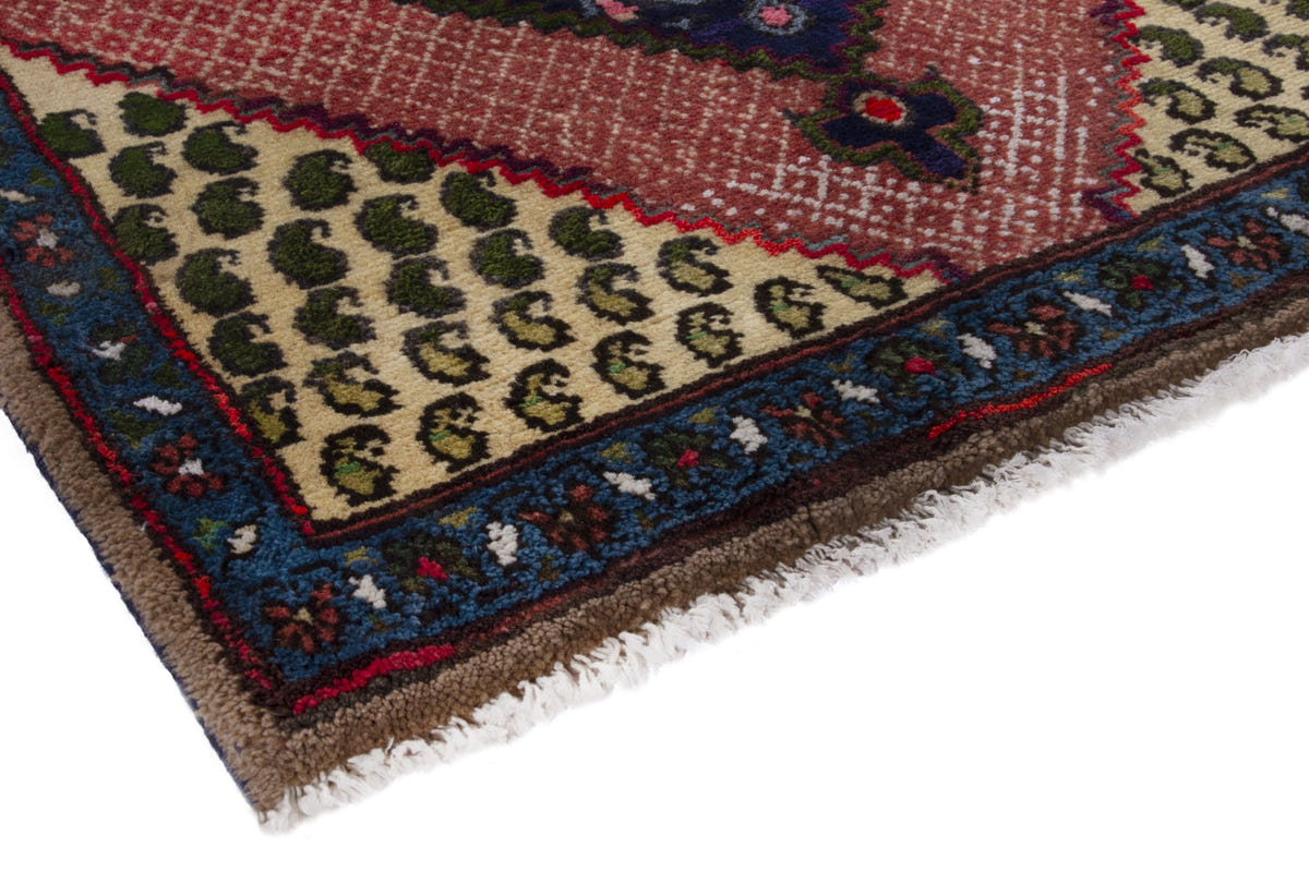Persian Songhor accent rug in navy and dusty rose, view 6 of 9