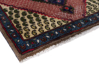 Persian Songhor accent rug in navy and dusty rose, view 6 of 9