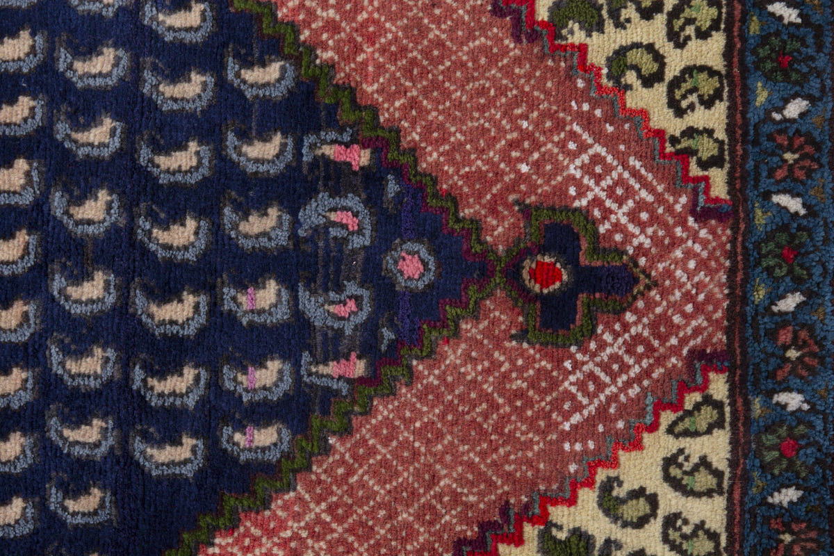 Persian Songhor accent rug in navy and dusty rose, view 7 of 9